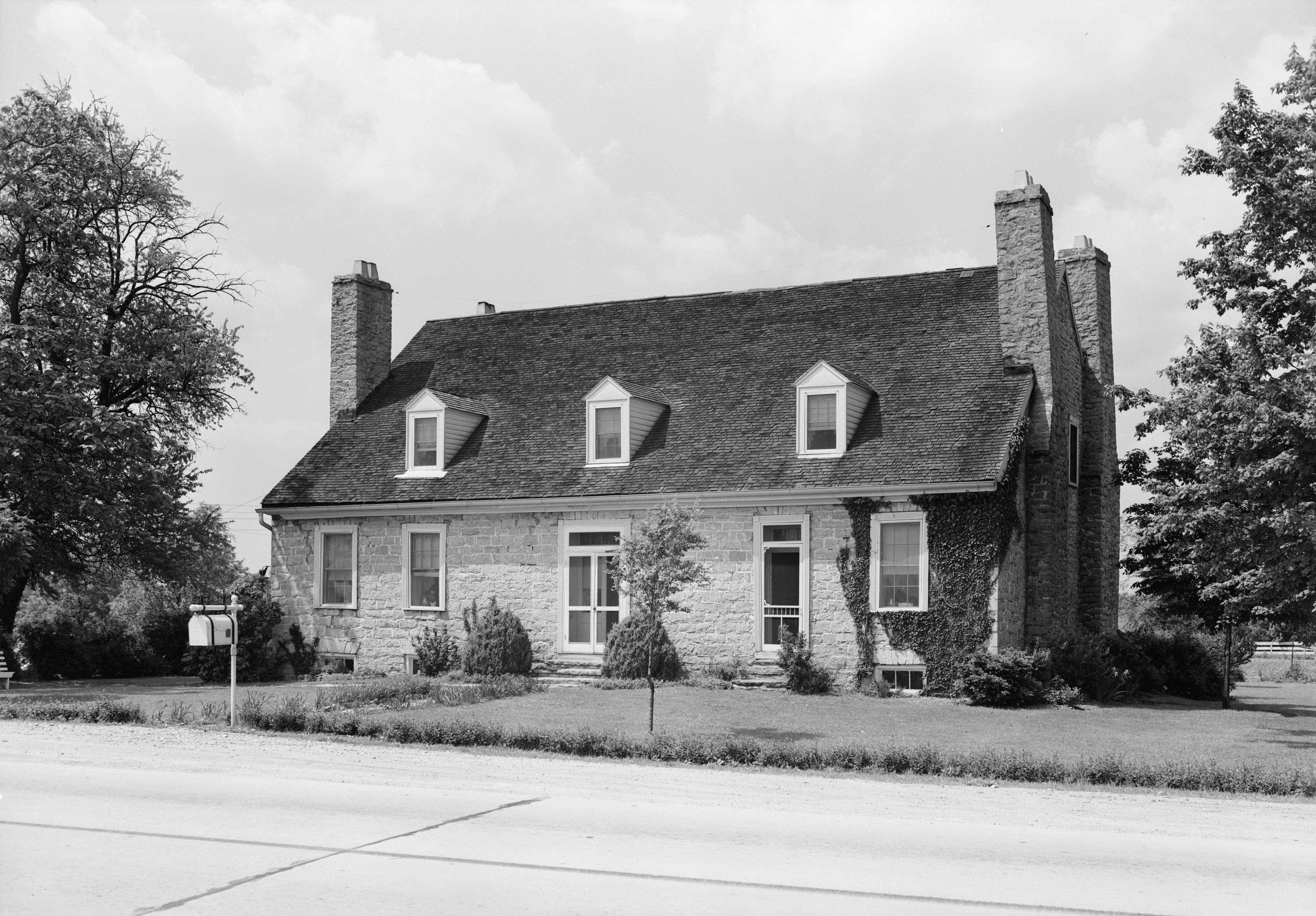 Front of the Old Stone Inn on U.S. 60 at Simpsonville — stagecoach tavern, private home, later restaurant. Built from local stone in the 1810s; NRHP 76000944. Marker 1889 stands at the road.